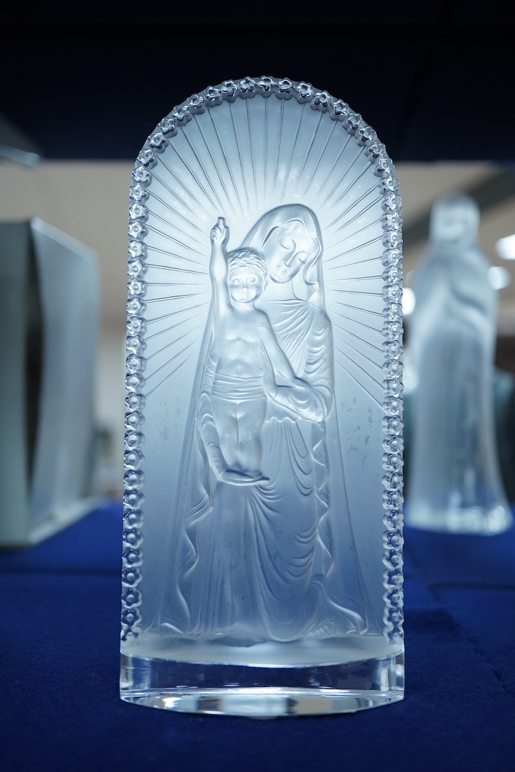 A Lalique ‘Vierge A L’Enfant Agenouille statue’ 20cm high, together with a model of ‘Virgin with hands together’, 25cm high (both boxed)